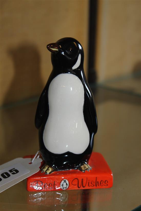 Royal Doulton Penguin Books advertising figure, modelled as penguin standing on a book inscribed Best Wishes